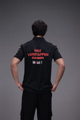 Person wearing a black shirt with 'Max Verstappen Daigen Mobil 1' branding on a gray background