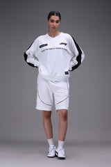Person wearing a white formula 1 jersey outfit with black accents on a gray background